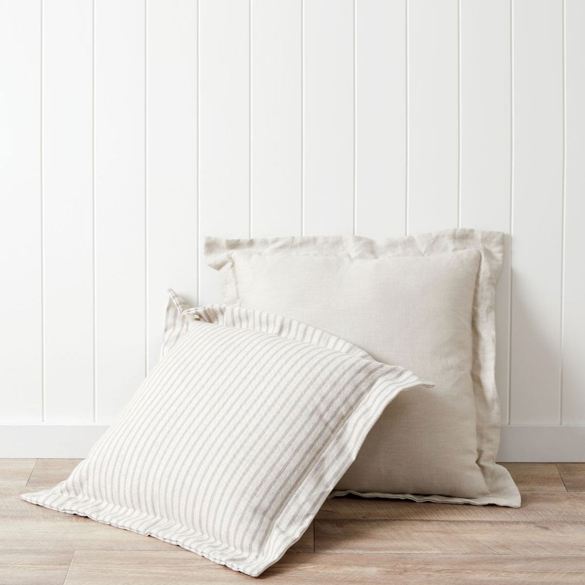 Grey and white striped shops cushion